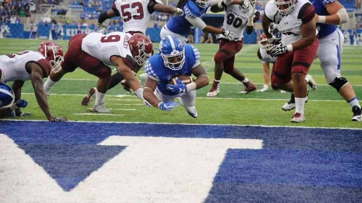 Kentucky true freshman Benny Snell dove into the end zone for one of the four touchdowns he scored against New Mexico State.