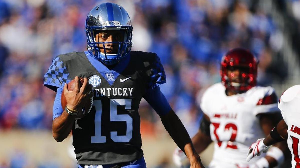 Kentucky quarterback Stephen Johnson looked for running room against Louisville at Kroger Field on Saturday.