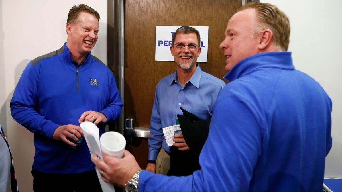 UK Coach Mark Stoops, right, joked with offensive coaches Darin Hinshaw, left, and Eddie Gran following the press conference introducing Gran and Hinshaw as UK assistants in January.