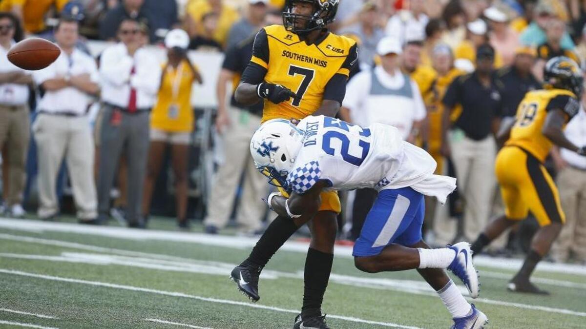 Southern Miss Golden Eagles quarterback Kwadra Griggs fumbled the ball while being tackled by Kentucky Wildcats safety Darius West (25)during their game at M.M. Roberts Stadium in Hattiesburg, Miss., Saturday, Sept. 2, 2017. Kentucky beat Southern Miss 24-17.