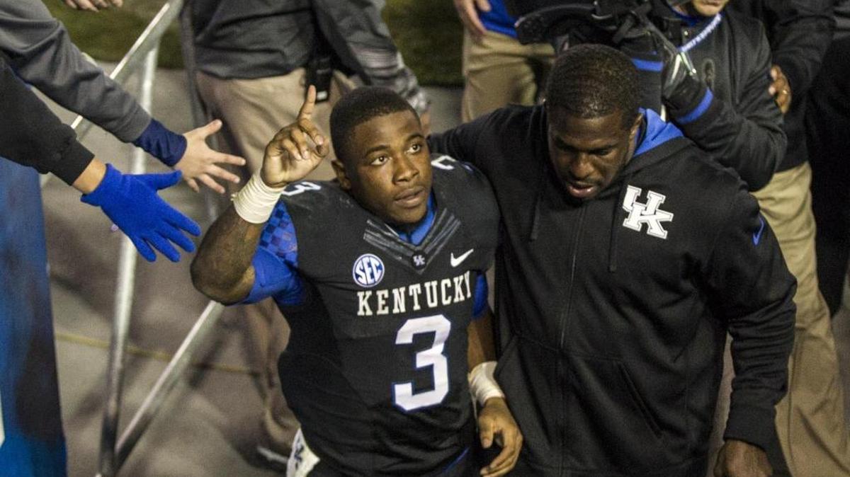 Kentucky Wildcats running back Jojo Kemp (3) greeted fans on the way to the locker room after UK defeated South Carolina 45-38 at Commonwealth Stadium on Saturday October 4, 2014 in Lexington, Ky.