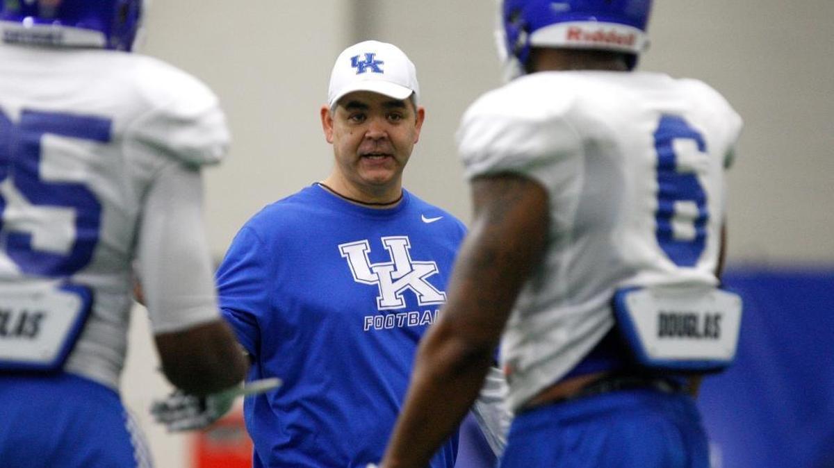UK linebackers coach Andy Buh interacted with his unit during UK football practice at Nutter Field House in Lexington, Ky., on March 11, 2015.