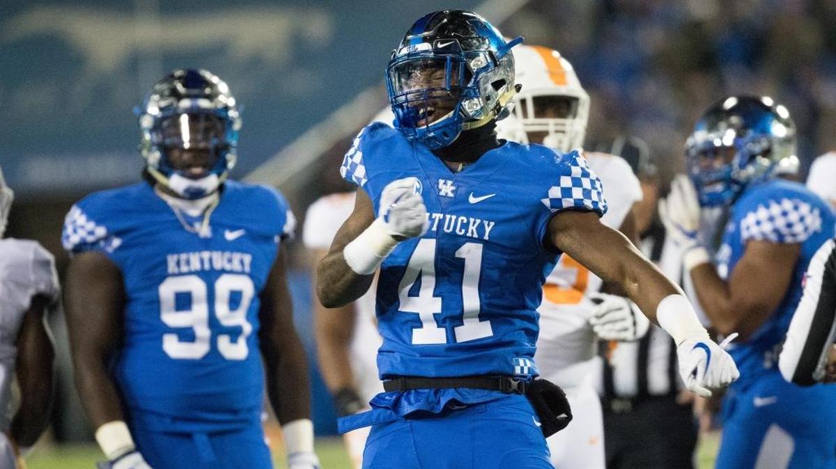 Kentucky outside linebackers, like Josh Allen (41) and Denzil Ware, are getting a new position coach who can help them take their games to the next level, UK’s Mark Stoops said.