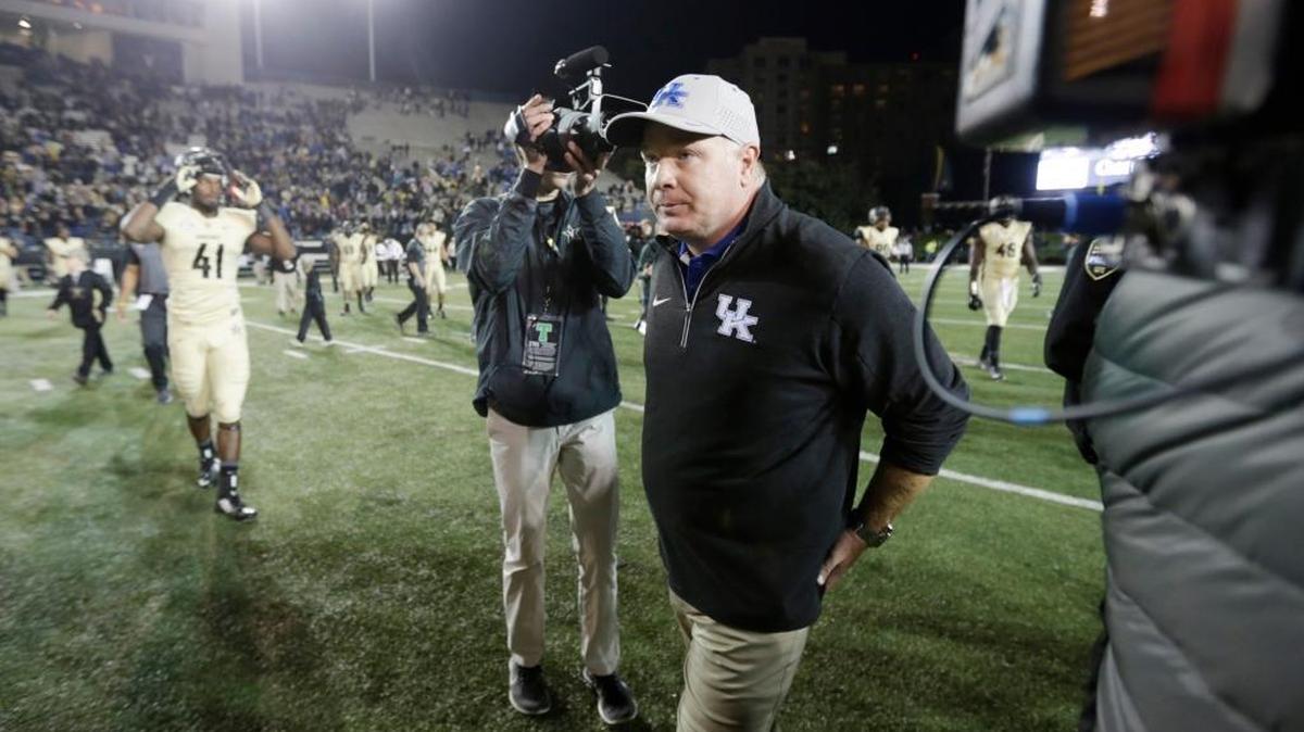 Kentucky head coach Mark Stoops walked past reporters to the locker room after the Kentucky at Vanderbilt football game at Vanderbilt Stadium in Nashville, Tenn.,, on Nov. 14, 2015. Vanderbilt beat Kentucky 21-17. Photo by Pablo Alcala | Staff