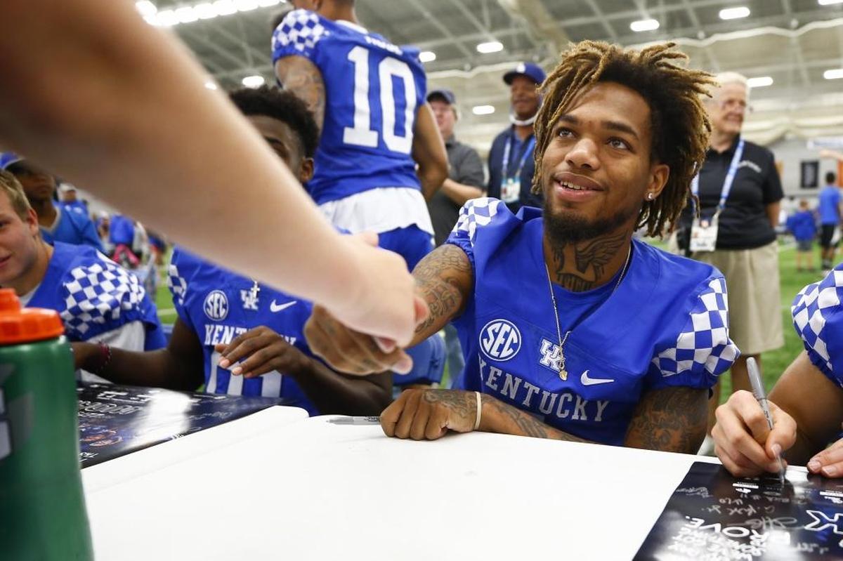 Freshman wide receiver Lynn Bowden greeted Will Collier, 13, of Lexington during UK Football Fan Day at Nutter Field House in Lexington on Aug. 5, 2017.
