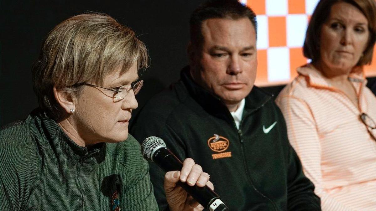 Tennessee football coach Butch Jones, center, listens as UT women’s basketball coach Holly Warlick speaks at a February news conference in which Volunteers coaches defended the culture toward women in the school’s athletics department against charges in a federal Title IX lawsuit.