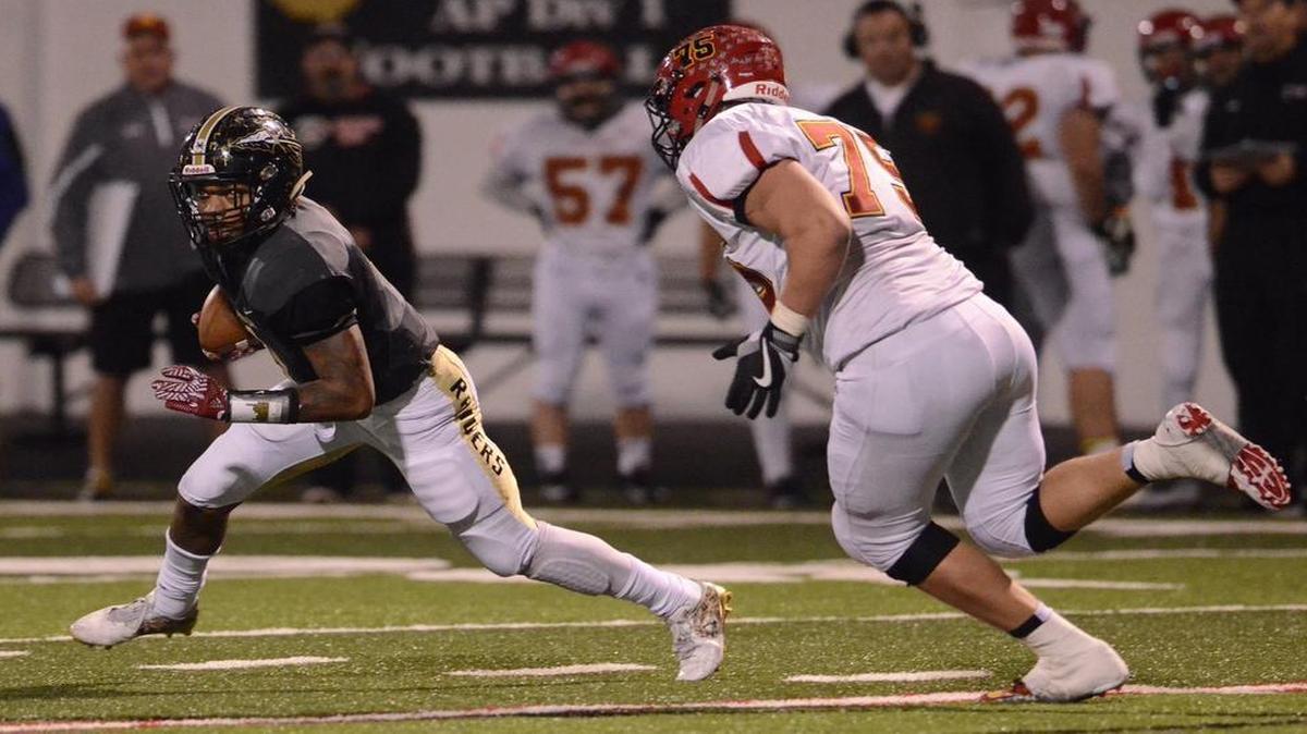 Lynn Bowden, left, is ranked by Scout.com as the No. 60 overall football prospect in the class of 2017.