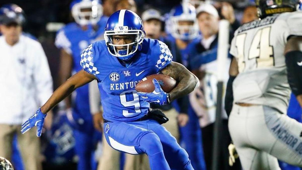 Kentucky Wildcats wide receiver Garrett Johnson (9) runs the ball past Vanderbilt Commodores safety Ryan White (14) during their game at Vanderbilt Stadium in Nashville, Tenn., Saturday, Nov. 11, 2017. Kentucky beat Vanderbilt 44-21.