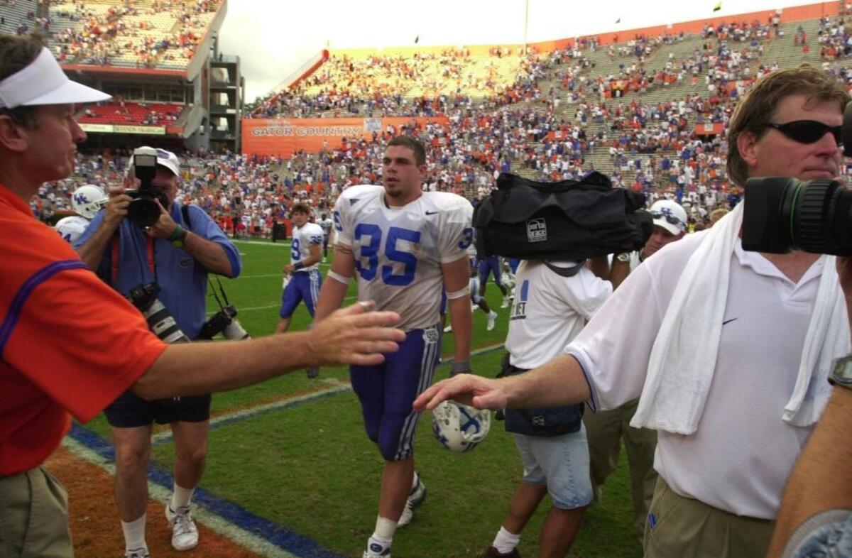 The coaches. Kentucky coach Hal Mumme and Florida coach Steve Spurrier “sort of shaking hands” after the Gators’ 59-31 win in Gainsville on Sept. 23, 2000. Mumme would be ousted under a cloud of an NCAA investigation. Spurrier would eventually try his luck in the NFL for a season.
