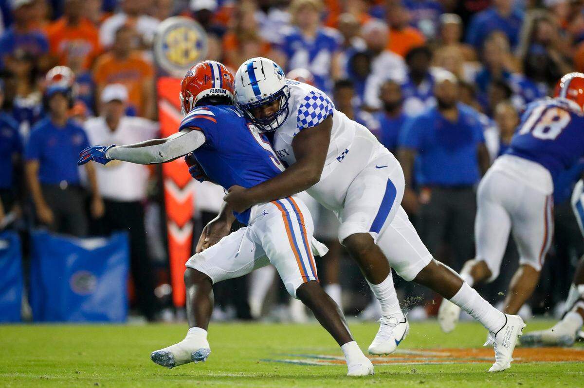 Freshman Deone Walker (0) announced himself to the college football world with a key tackle for loss late in the Wildcats’ Sept. 10 win at Florida.