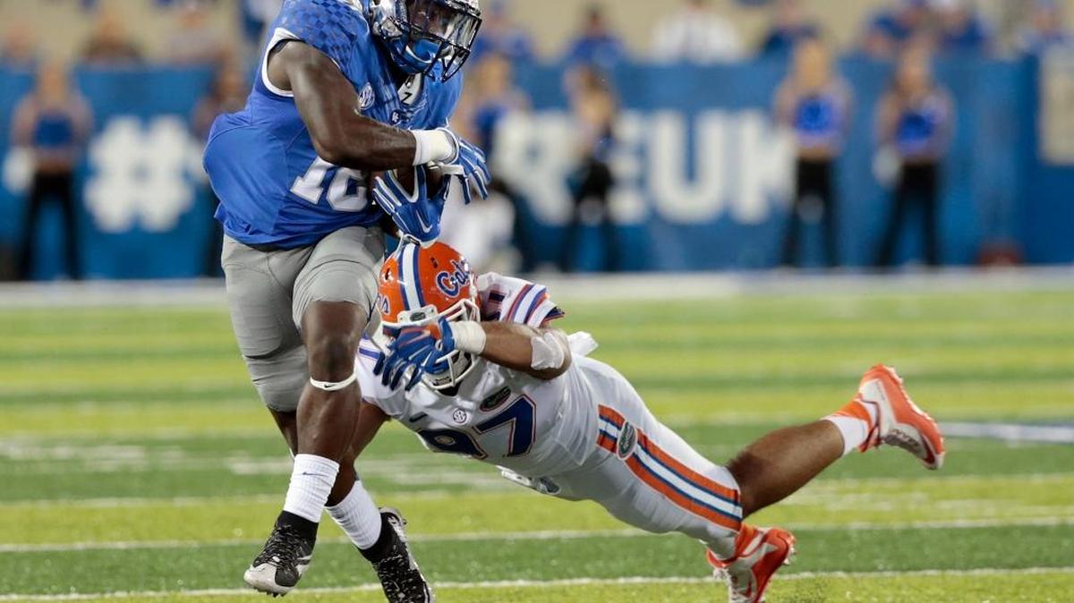 Kentucky running back Boom Williams eluded Florida defensive lineman Justus Reed during last season’s meeting at Commonwealth Stadium.