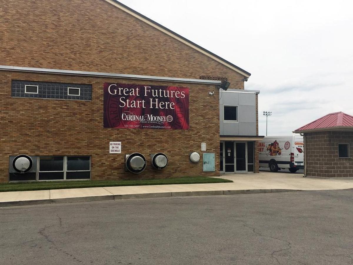 A sign hangs on the gymnasium at Cardinal Mooney High School in Youngstown, Ohio, that says, “Great Futures Start Here.” It was the starting spot for many successful coaches, including Kentucky’s Mark Stoops and Oklahoma’s Bob Stoops as well as Sooners defensive coordinator Mike Stoops.