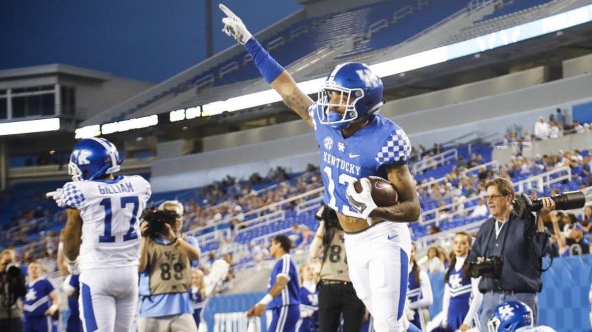 Kentucky wide receiver Zy’Aire Hughes (13) celebrated a touchdown during the Blue-White Spring Game on Friday at Kroger Field.