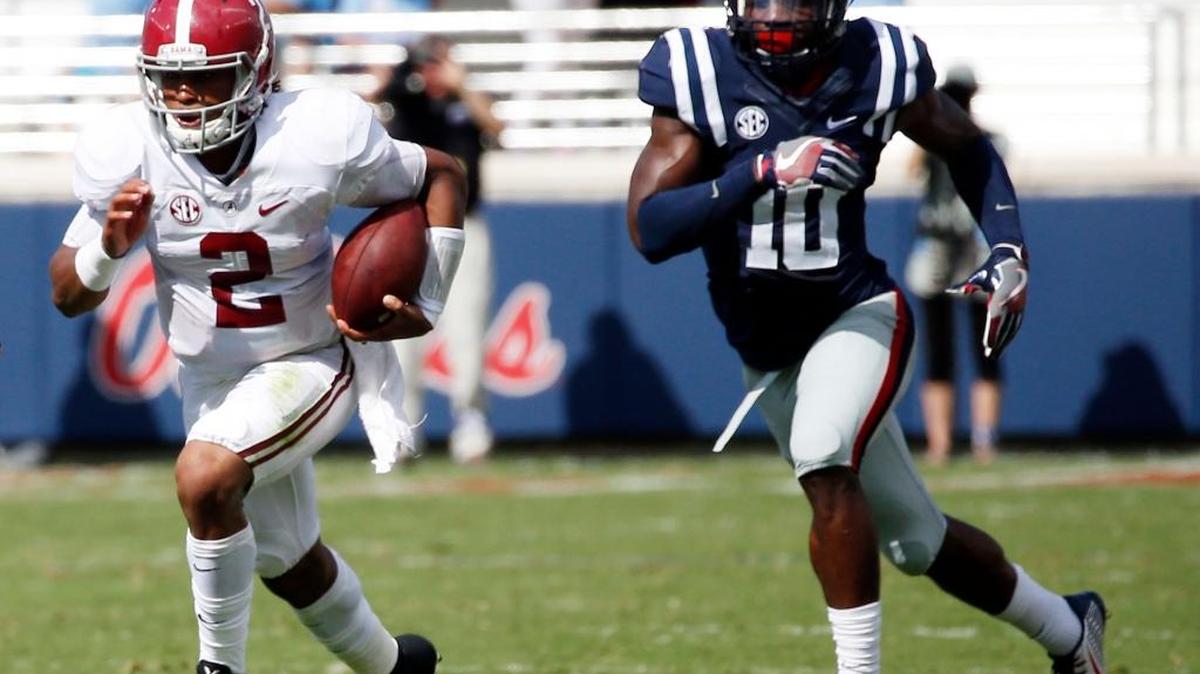 Alabama quarterback Jalen Hurts (2) runs away from Mississippi defensive end Marquis Haynes (10) in the first half of an NCAA college football game, Saturday, Sept. 17, 2016 in Oxford, Miss.