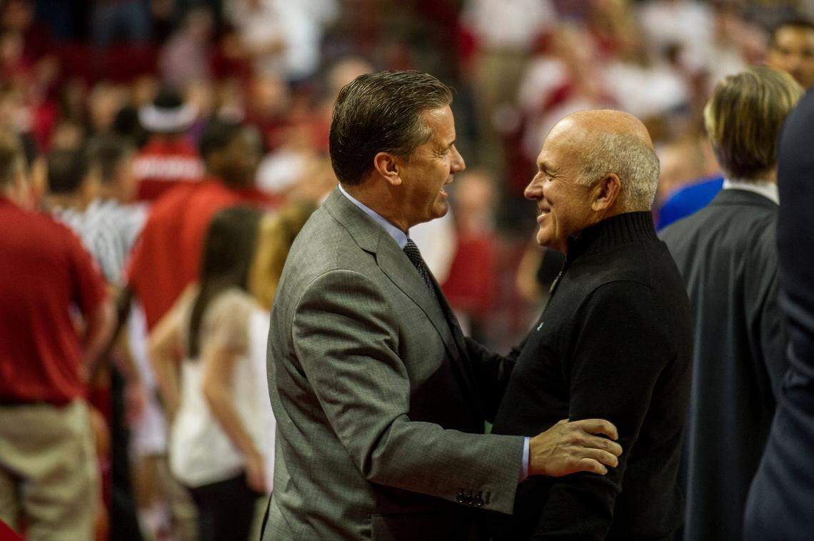 Kentucky head coach John Calipari talks with Tyson Foods chairman John Tyson before a 2014 game against the Arkansas Razorbacks at Bud Walton Arena. The two are longtime friends.
