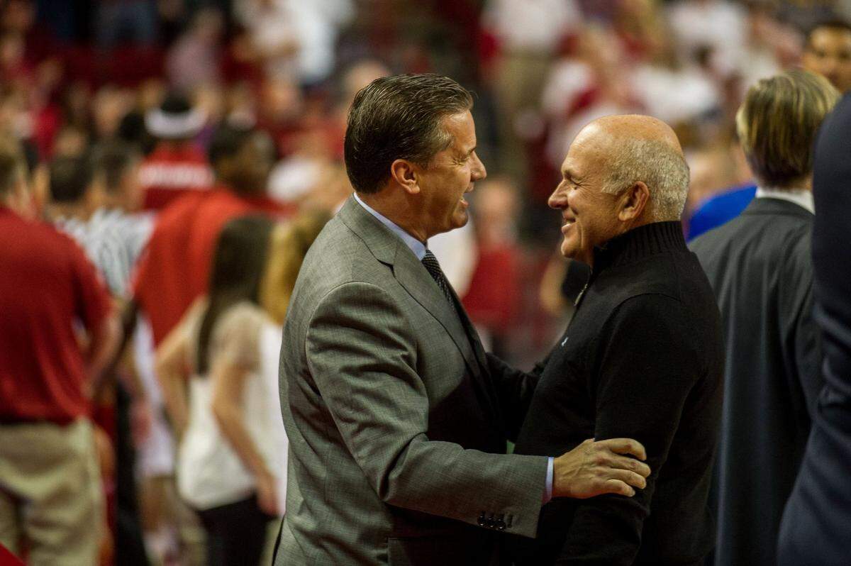 Kentucky head coach John Calipari talks with Tyson Foods chairman John Tyson before a 2014 game against the Arkansas Razorbacks at Bud Walton Arena. The two are longtime friends.