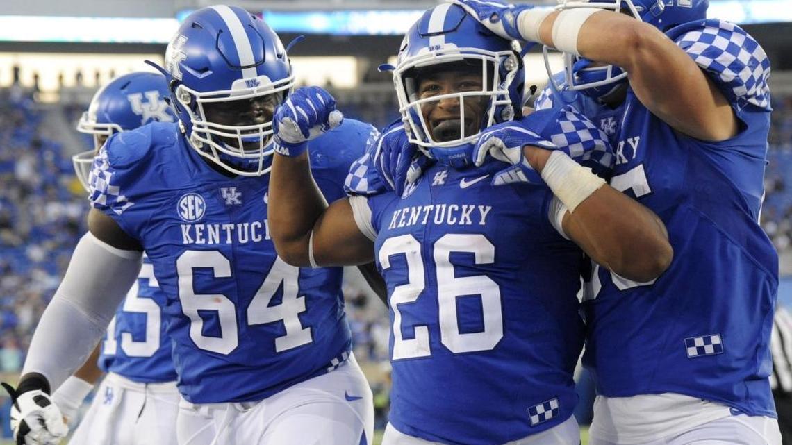 UK freshman RB Benny Snell celebrates scoring his fourth touchdown early in the 4th quarter of the University of Kentucky-New Mexico State football game at Commonwealth Stadium on Saturday.