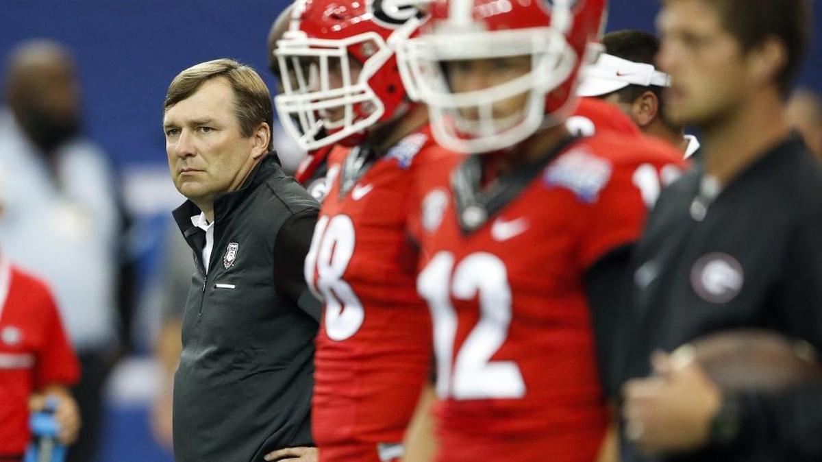 Kirby Smart, left, is off to a 4-3 start in his first season as head coach at Georgia.
