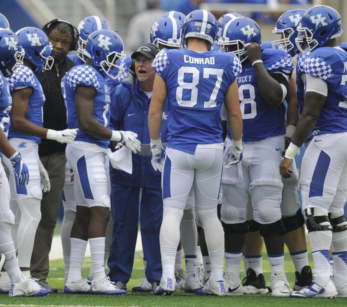 UK assistant head coach for offense, Eddie Gran, huddled with his unit during a game last year. Kentucky is hopeful it can improve on its scoring and yards per game averages now that the team is more familiar with Gran’s playbook.