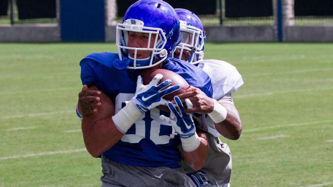Kentucky wide receiver Charles Walker caught the ball as Mike Edwards defended during practice in mid-August.