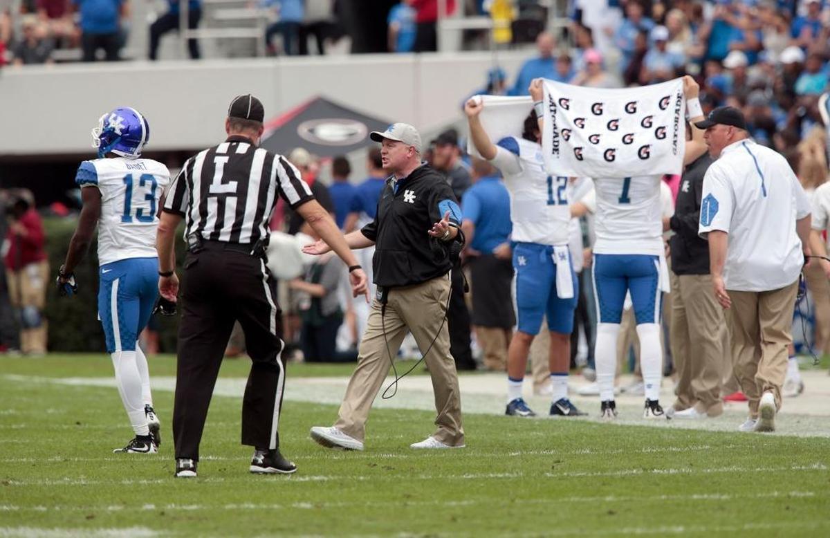 Under new SEC rules adopted for this season, if a coach comes out onto the green part of the field to argue a call with officials, he will be flagged for an unsportsmanlike penalty.