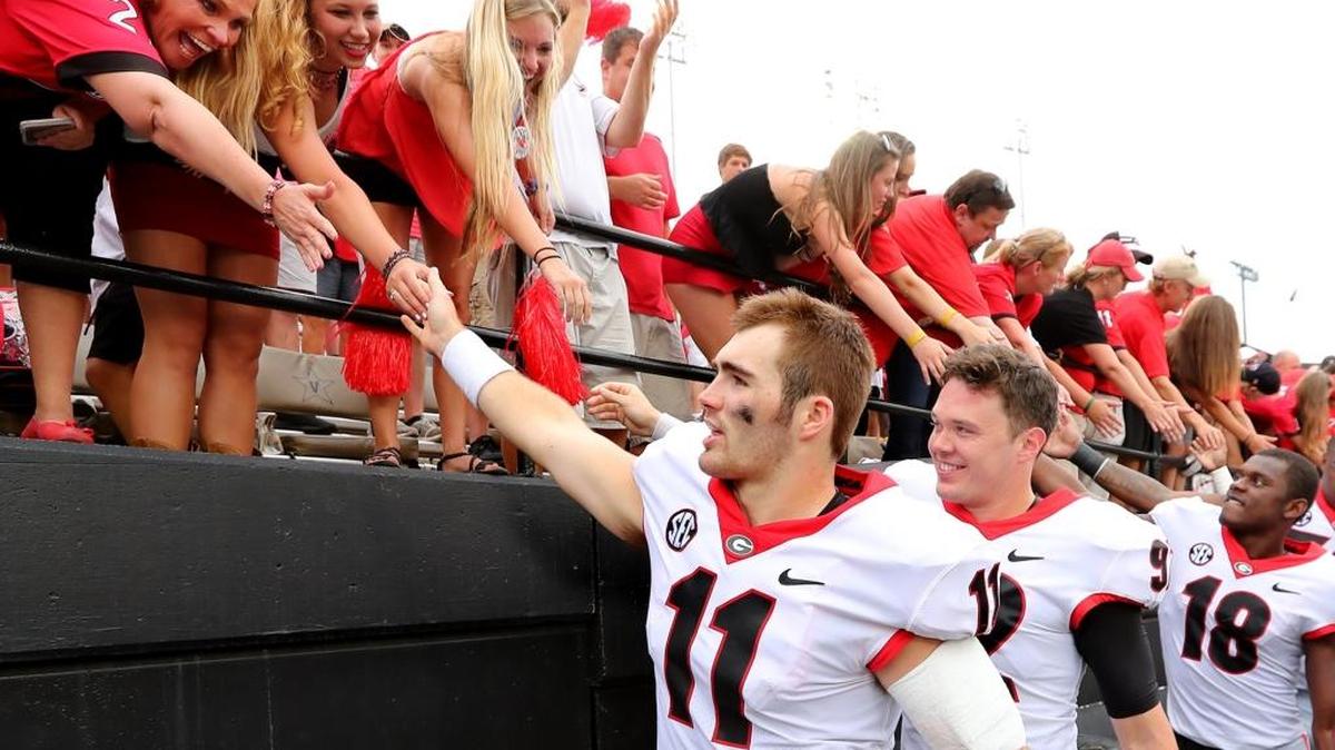Georgia quarterback Jake Fromm (11) and the Bulldogs celebrate with fans after a 45-14 victory against Vanderbilt on Saturday, Oct. 7, 2017, at Vanderbilt Stadium in Nashville, Tenn.