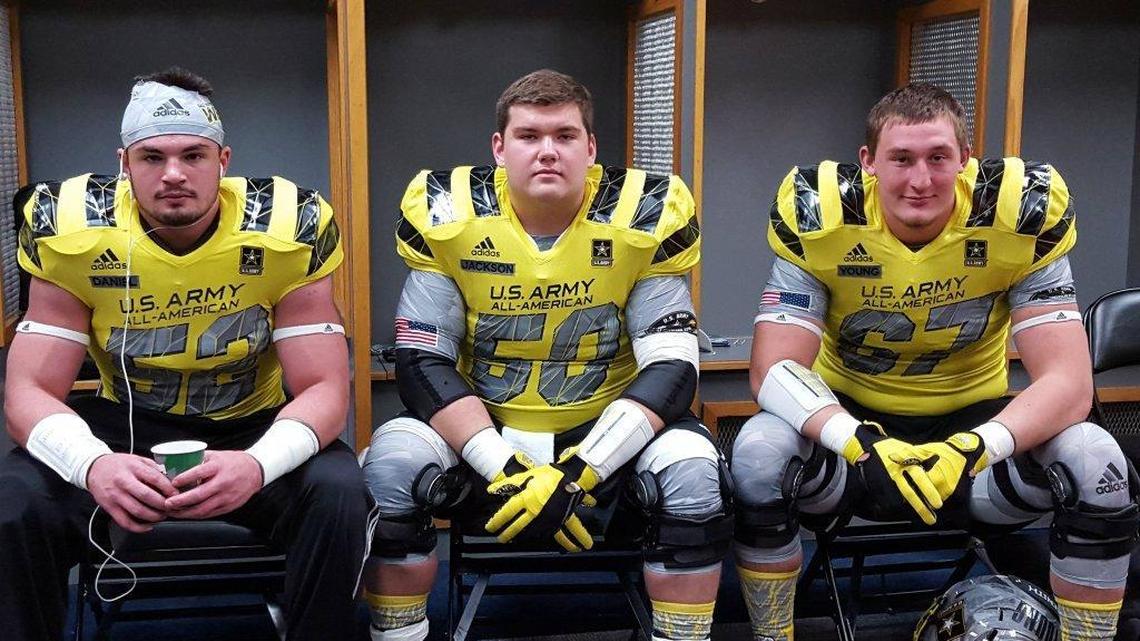 Kash Daniel, left, sat with future UK football teammates Drake Jackson, center, and Landon Young in the West locker room before Saturday’s U.S. Army All-American Bowl in San Antonio.