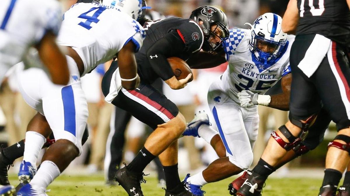 Kentucky Wildcats linebacker Joshua Paschal (4) and Kentucky Wildcats defensive end Denzil Ware (35) stopped South Carolina Gamecocks quarterback Jake Bentley (19) during their game at William Brice Stadium in Columbia, S.C., Saturday, Sept. 16, 2017.