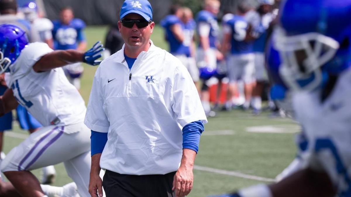 Wide Receivers coach Tommy Mainord watched the wide receivers drill at the University of Kentucky's football practice Aug. 18, 2015 in Lexington.