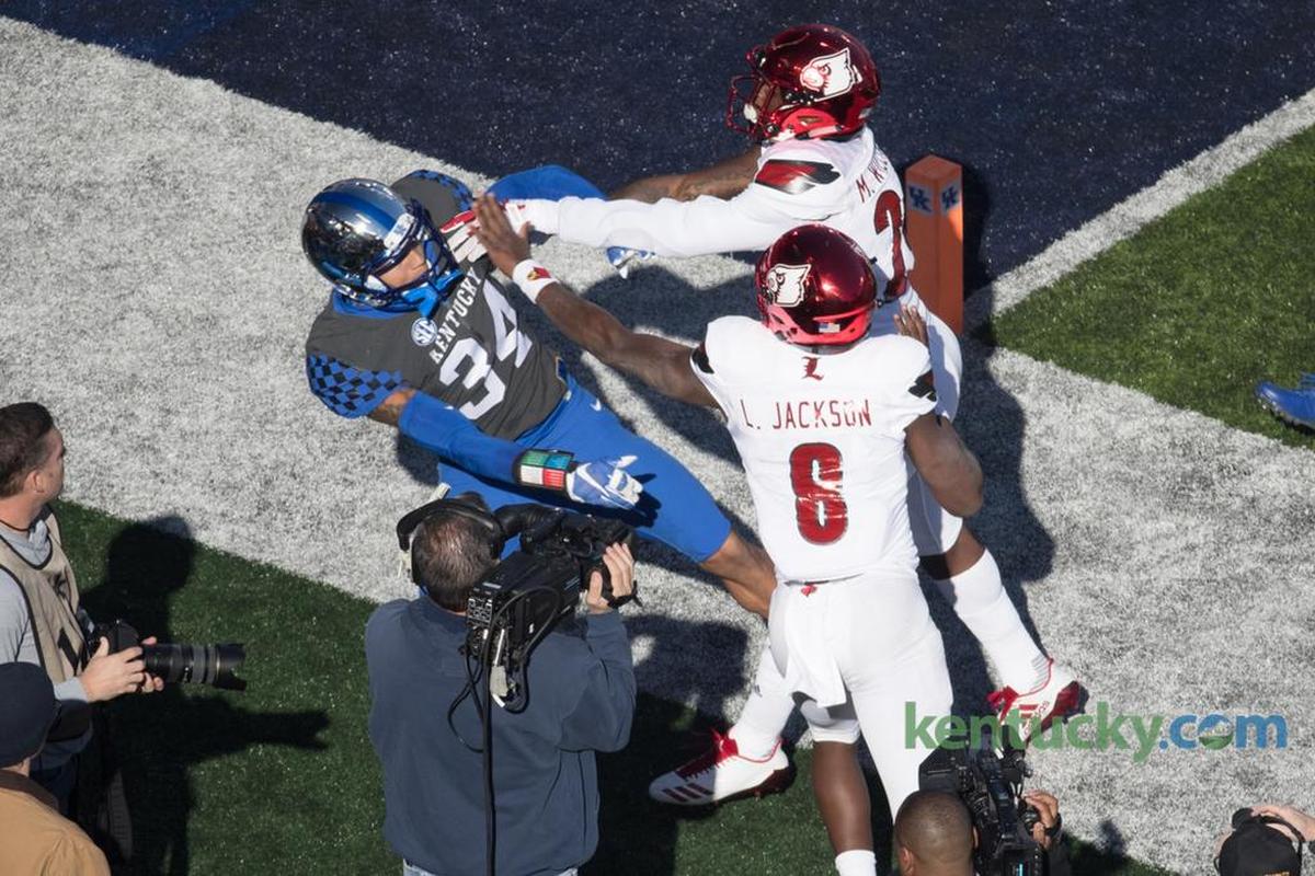 Kentucky linebacker Jordan Jones (34) became involved in a scuffle with Louisville quarterback Lamar Jackson (8) during U of L’s 44-17 rout of UK last season at Kroger Field.