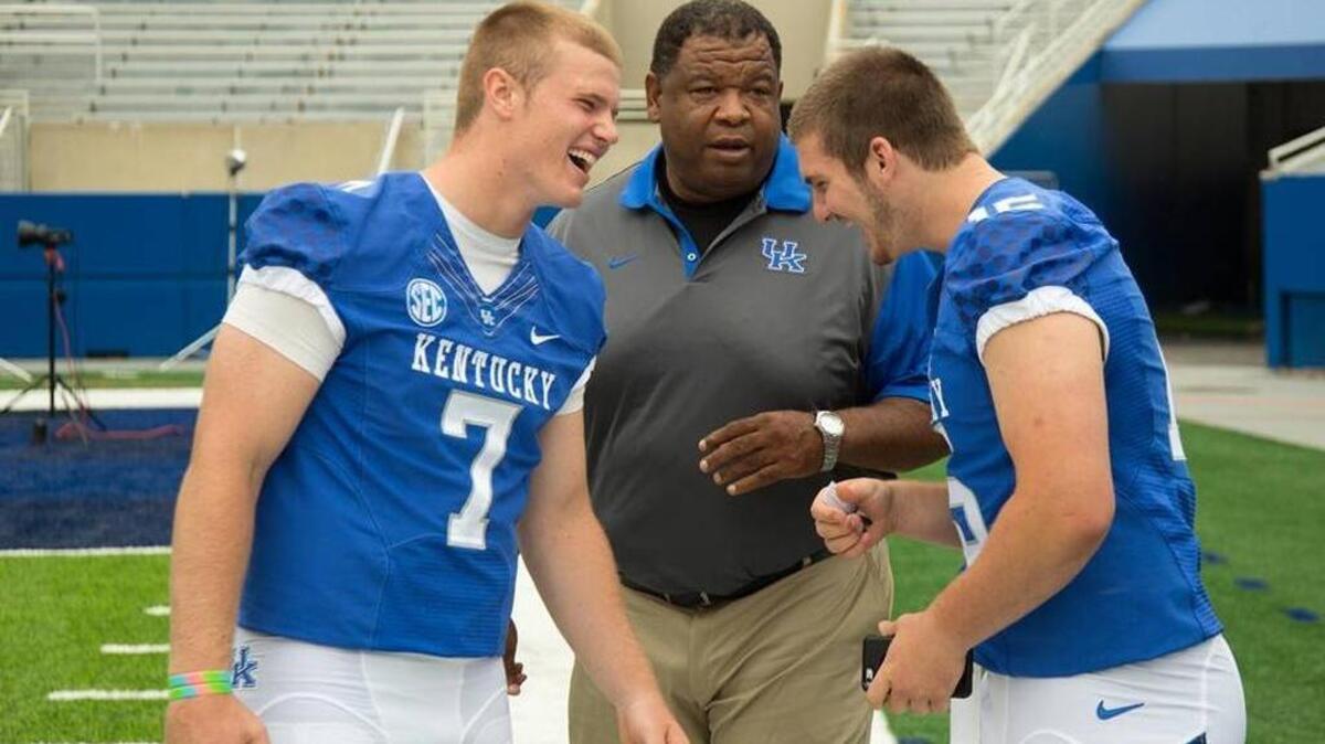 UK tight ends coach Vince Marrow joked around with Drew Barker, left, and C.J. Conrad during the program’s media day in August. Marrow is the Wildcats’ primary recruiter for the state of Ohio.