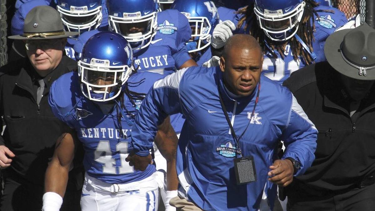 Joker Phillips led the Wildcats onto the field for the BBVA Compass Bowl in Birmingham, Ala., on Jan. 8, 2011. UK has not played in a bowl game since then.