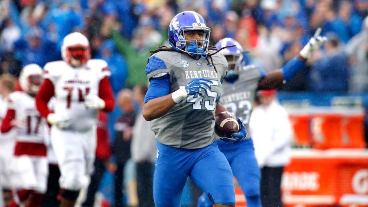 Kentucky Wildcats linebacker Josh Forrest (45) had an open field on his long interception for a touchdown as the University of Kentucky played the University of Louisville at Commonwealth Stadium in Lexington Saturday, Nov. 28, 2015.