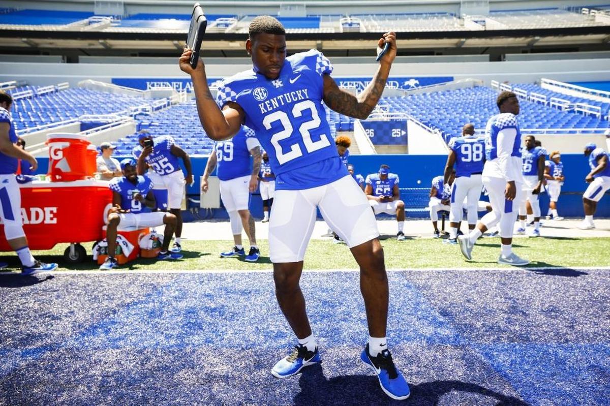 Kentucky running back Sihiem King danced along with a song on his iPad during Media Day at Kroger Field.