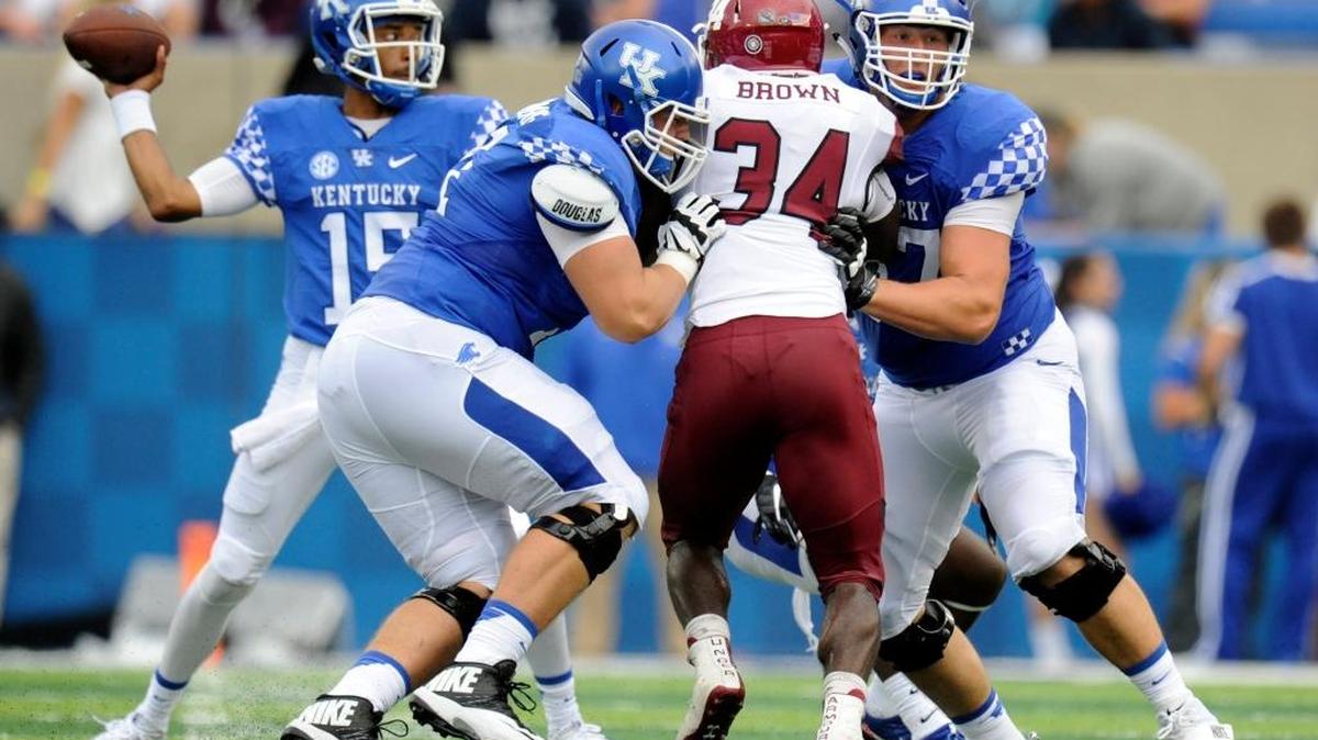 Logan Stenberg, left, and Landon Young blocked for quarterback Stephen Johnson against New Mexico State.