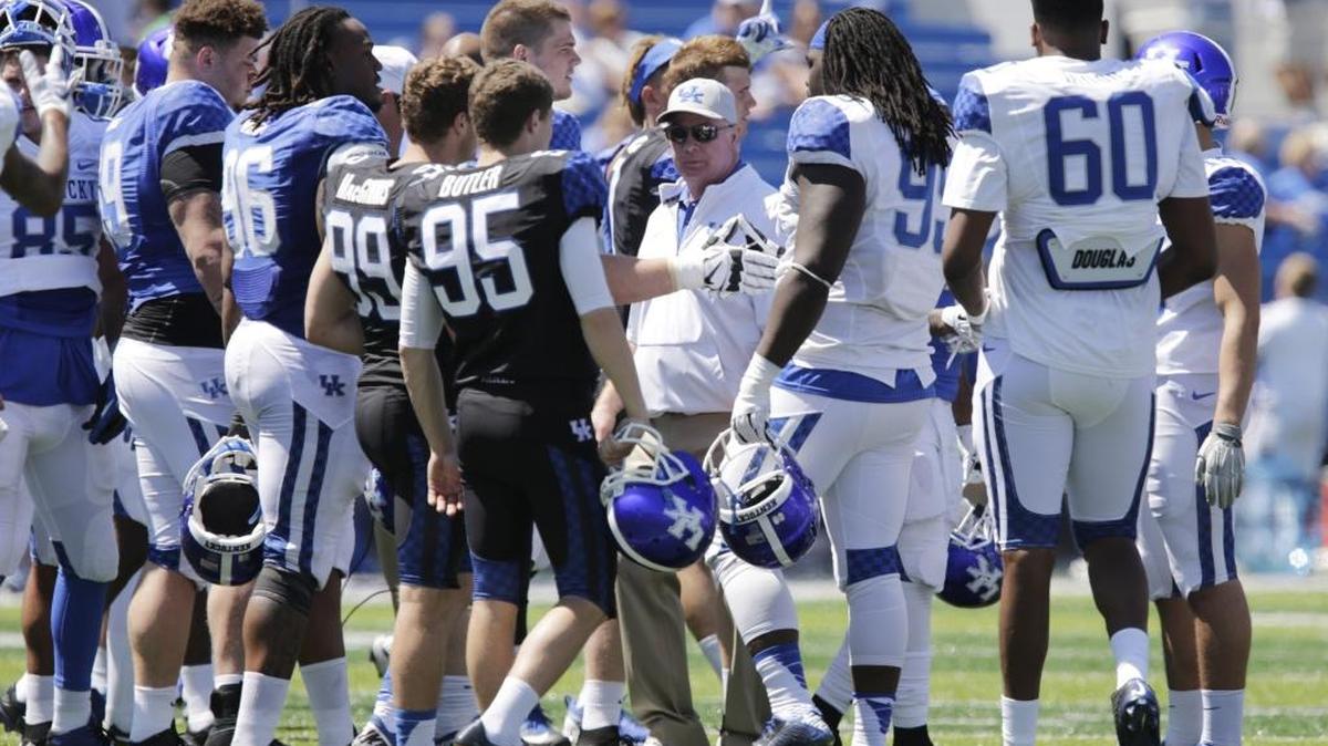 The teams shook hands after the Blue’s 31-20 win over White in the spring football game at Commonwealth Stadium in Lexington on April 16, 2016.
