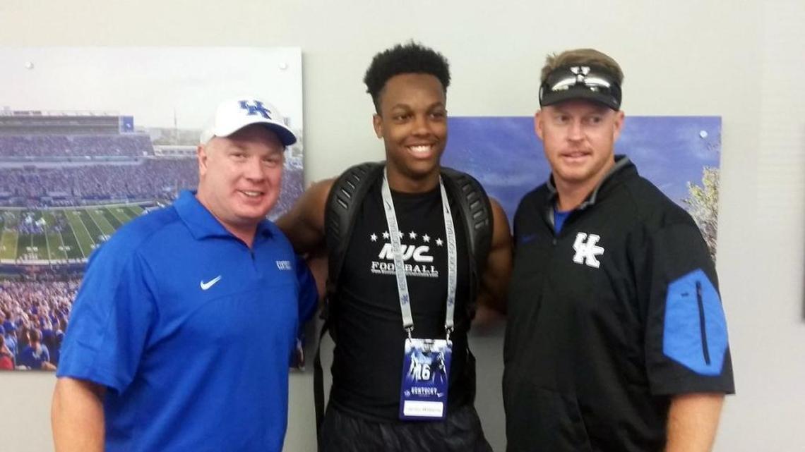 Jarren Williams, center, posted a photo to Twitter of himself with Coach Mark Stoops, left, and Darin Hinshaw during one of his recent visits to UK.