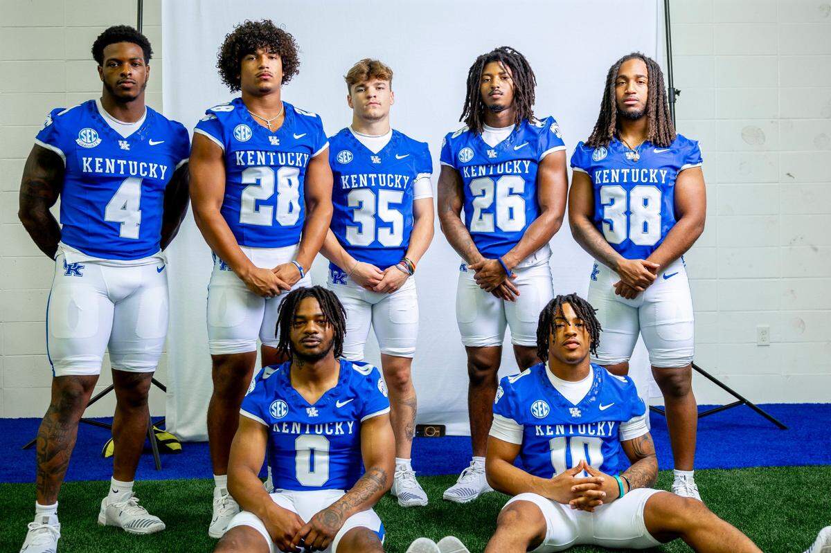 Kentucky’s running backs for 2024, clockwise from top left, include DeaMonte “Chip” Trayanum (4), Jovani Mizell (28), Jake Krekeler (35), Jason Patterson (26), Henry Bennett (38), Jamarion Wilcox (10) and Demie Sumo-Karngbaye (0).