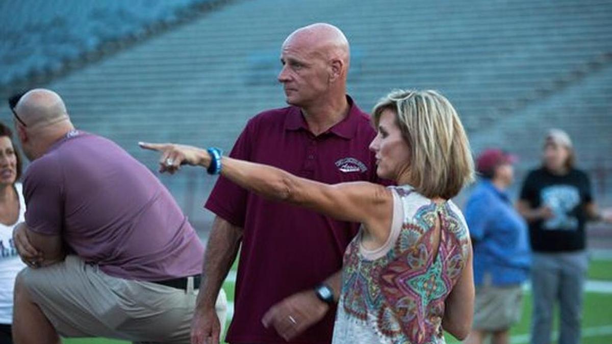 New Mexico State head coach Doug Martin, with his wife Vicki, right, at the 2016 Aggies Women’s Clinic in July. The couple met as students at the University of Kentucky.