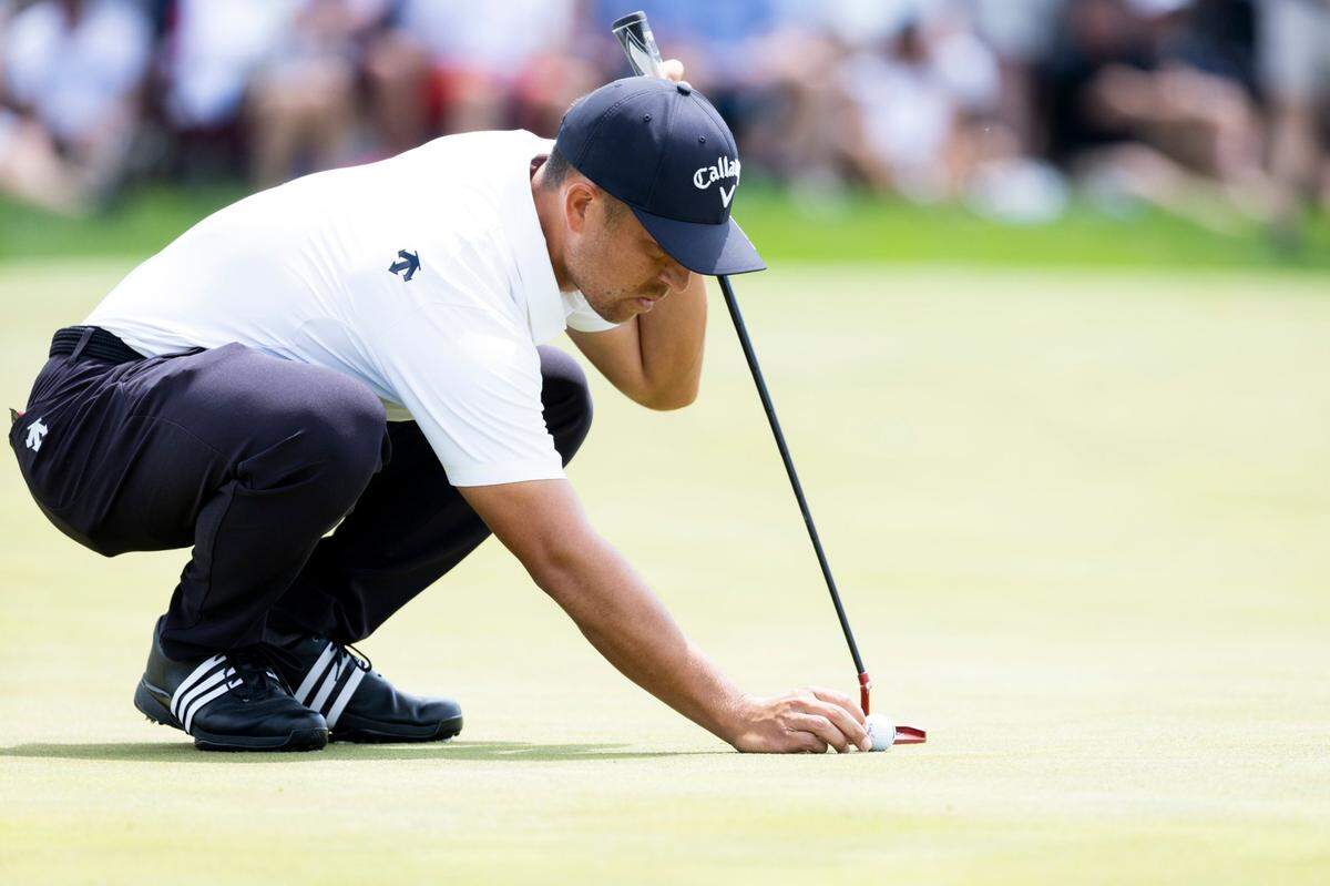 Xander Schauffele sets up a put on hole 7 during the first round of the PGA Championship at Valhalla Golf Course in Louisville, Ky, Thursday, May 16, 2024.