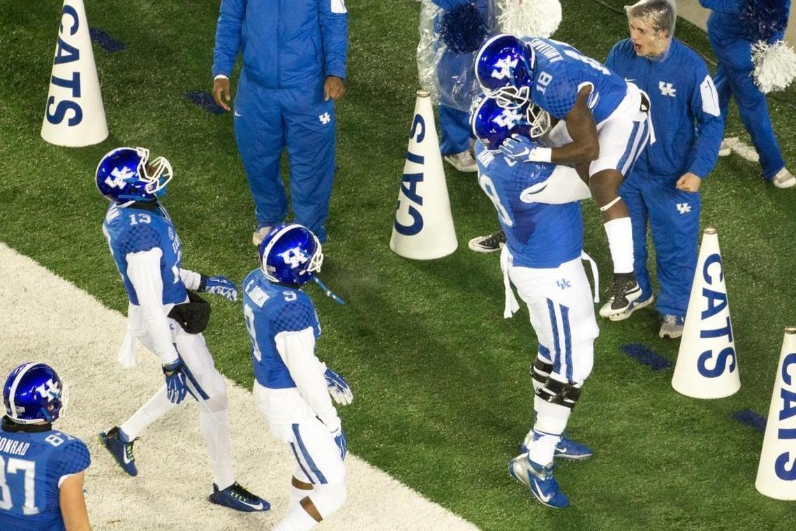 Nick Haynes gave teammate Boom Williams a lift after the UK running back scored a touchdown in 2015.
