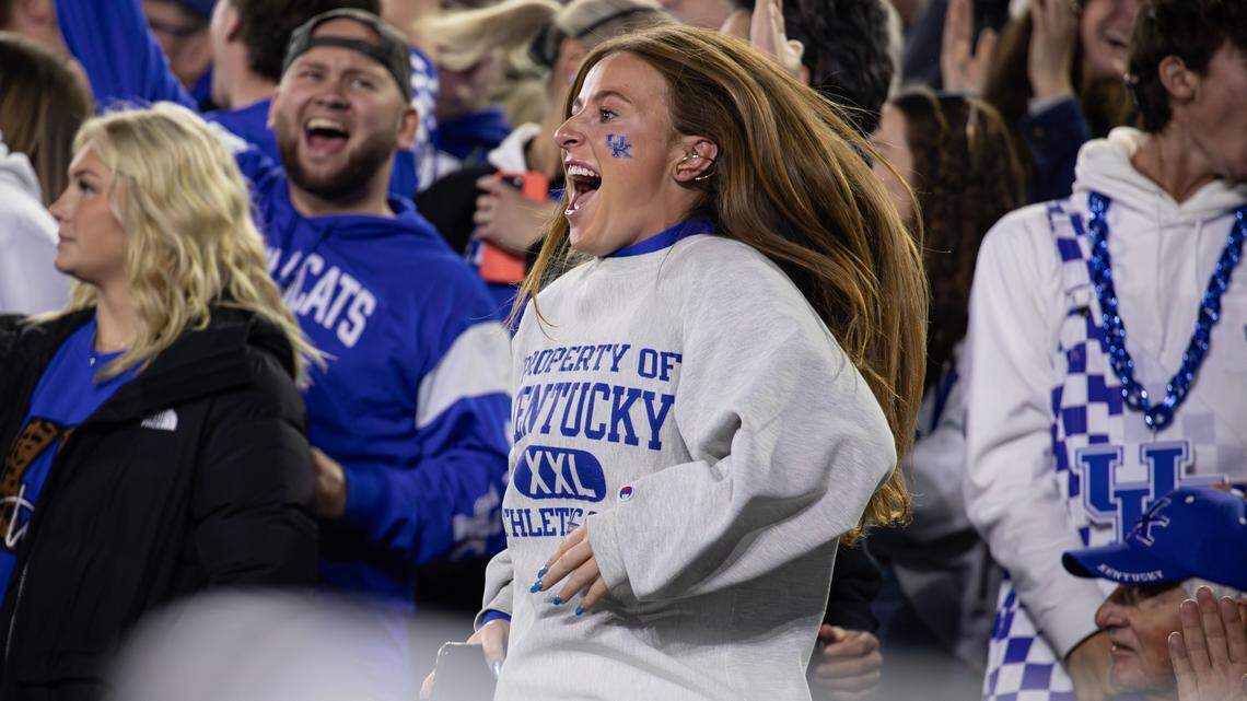 A Wildcats fan celebrates a UK touchdown during against Florida at Kroger Field on Saturday.