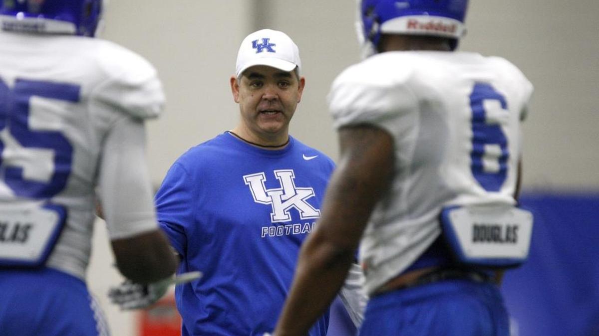 UK linebackers coach Andy Buh interacted with his unit during UK football practice at Nutter Fieldhouse in Lexington on Wednesday, March 11, 2015.