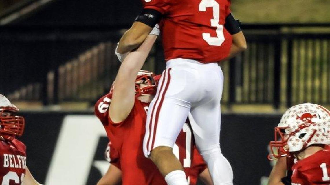 Austin Dotson, bottom, lifted Belfry teammate Xondre Willis into the air to celebrate a touchdown in the Pirates’ victory over Lexington Catholic in the 2015 Class 3A state finals. Belfry has won four-straight 3A state championships.