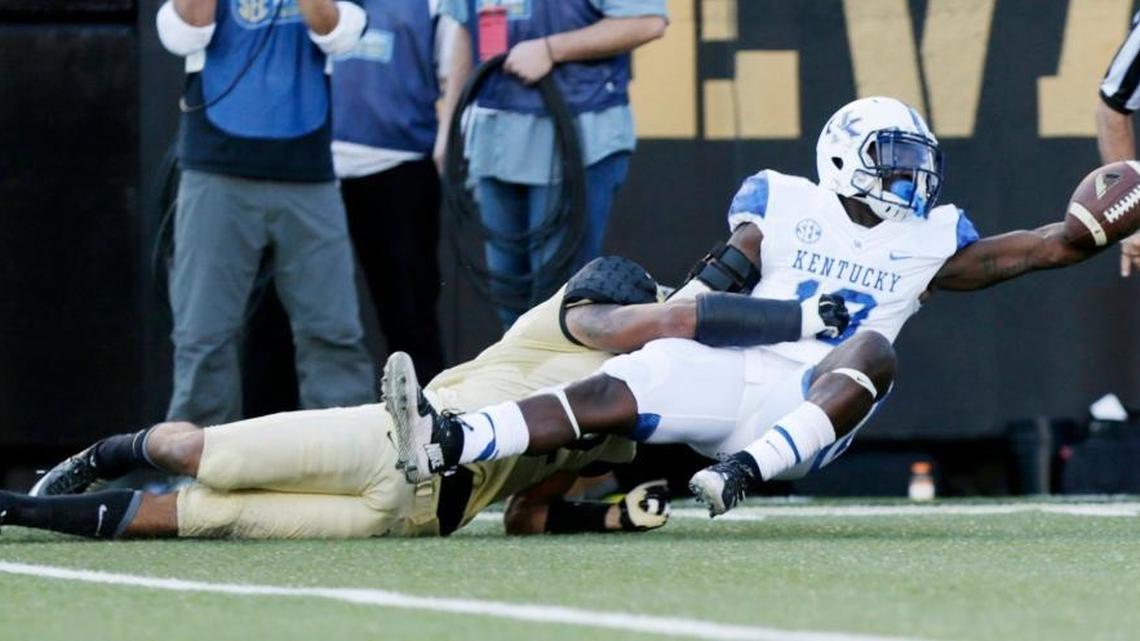 Kentucky running back Boom Williams stretched the ball toward the Vanderbilt goal line in an unsuccessful effort to score a touchdown in last season’s 21-17 UK loss in Nashville.