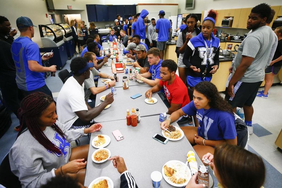 First-year University of Kentucky athletes eat Cajun shrimp stew during a cooking lesson as part of the "My New Kentucky Home" program at the E.J. Nutter Training Facility in Lexington, Ky., Thursday, July 6, 2017. My New Kentucky Home helps teach first-year student athletes college living.