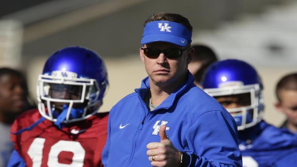 UK quarterbacks coach Darin Hinshaw gave a thumbs up during a spring football practice on March 26.