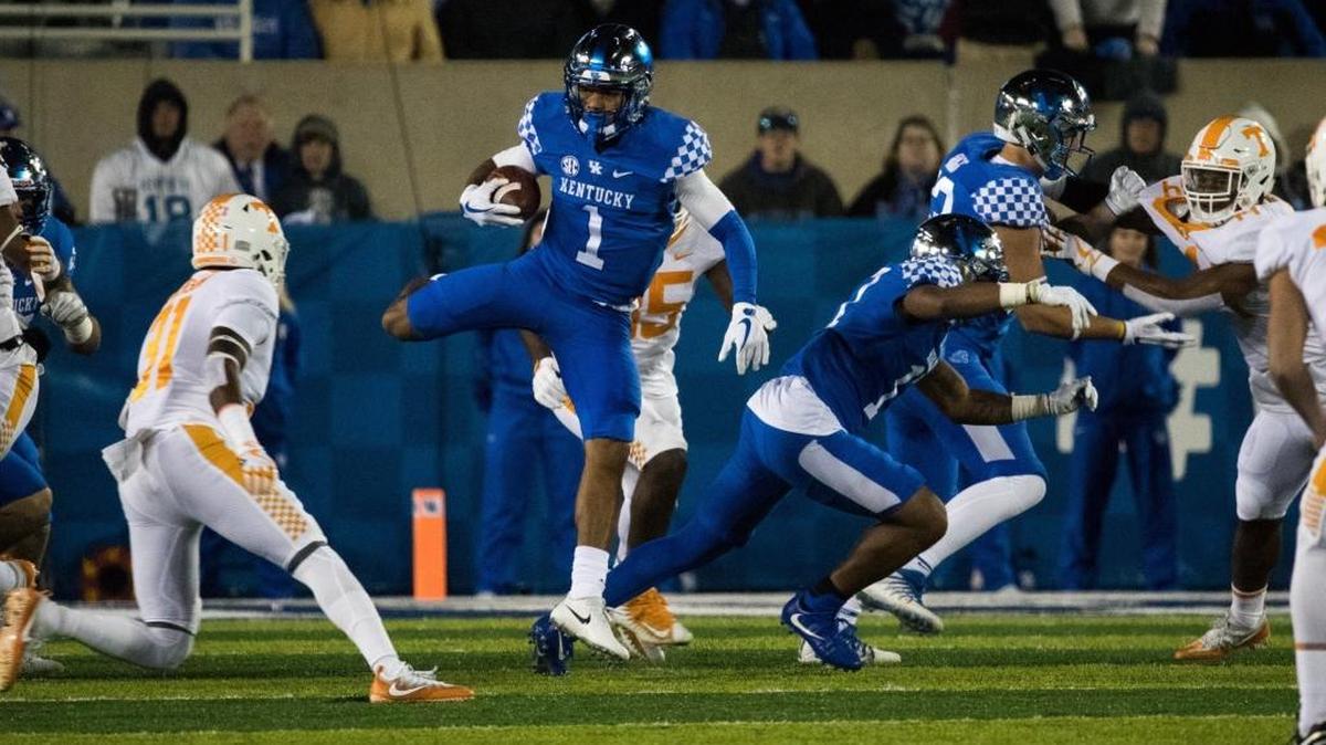 Kentucky’s Lynn Bowden Jr. (1) looked for running room against Tennessee at Kroger Field on Saturday night.