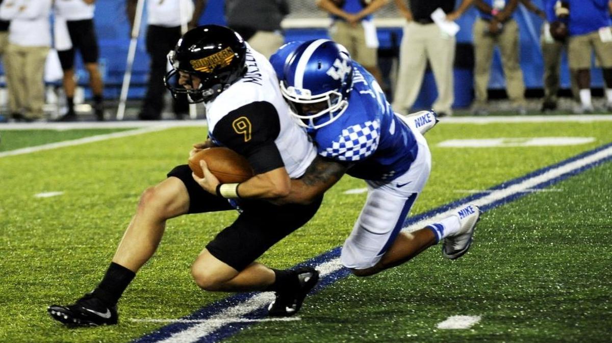 Kentucky linebacker Jordan Jones sacked Southern Mississippi quarterback Nick Mullens during the first quarter at Commonwealth Stadium on Saturday.