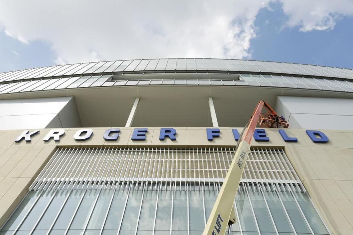 Mark Peel and Elijah Couch of Instant Signs finished the south facing sign of Kroger Field in Lexington, Ky, on July 26, 2017. Each letter is about five feet high. Matching lettering is already installed on the north facing side.